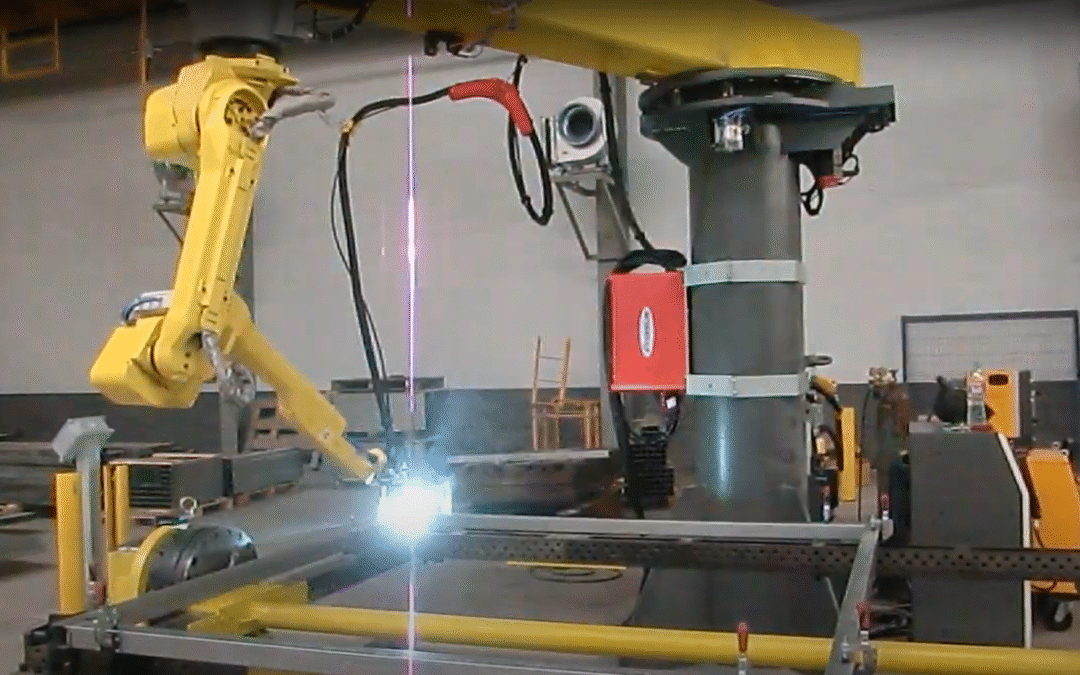 A robotic welding arm in action on a Gate frame