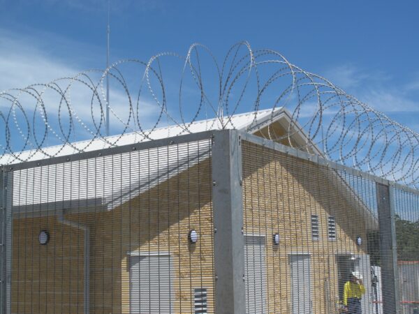 Concertina razor wire coils creating a high-security barrier