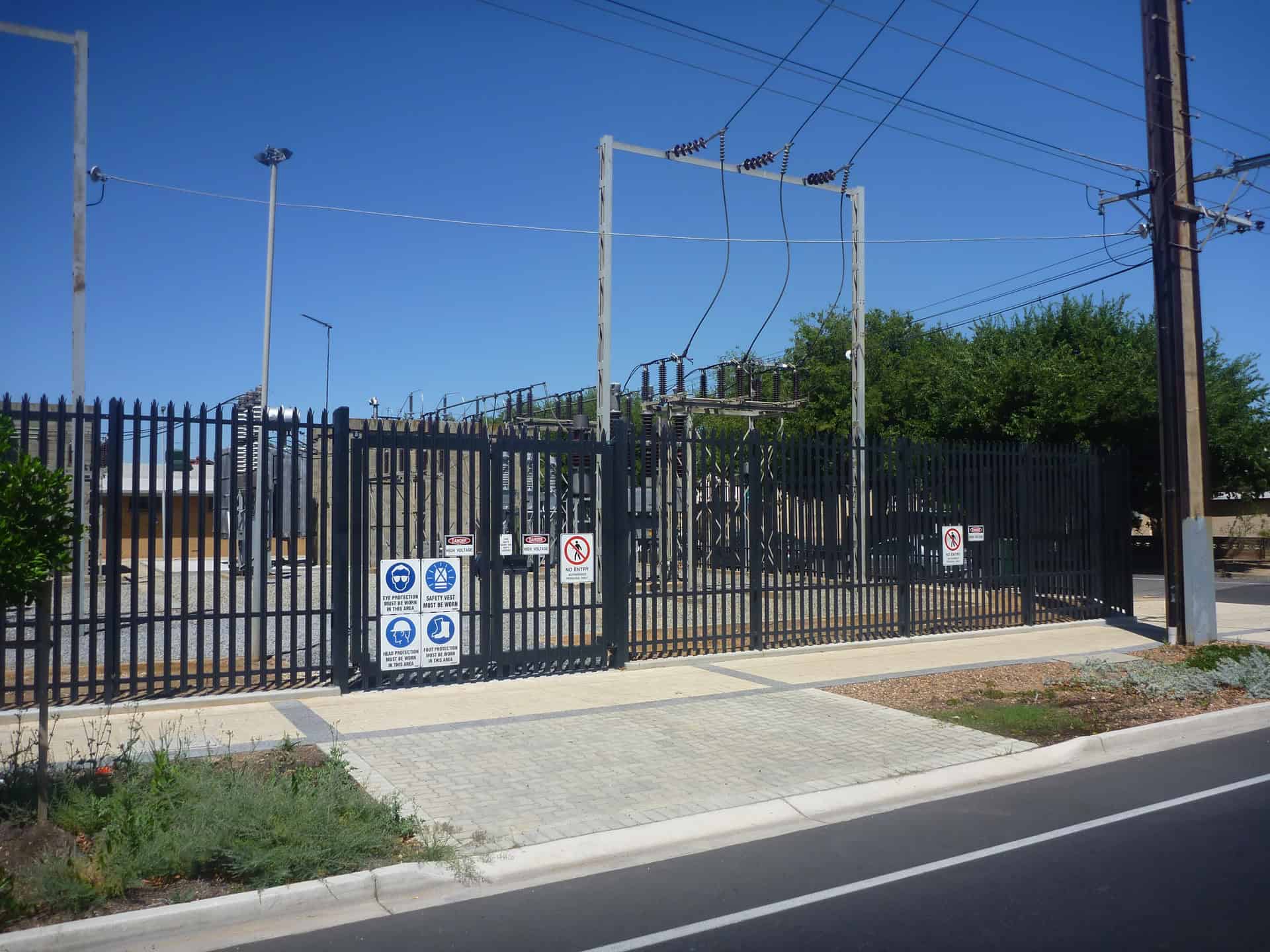electrical-substation-perimeter-palisade-security-fencing Electrical substation protected by palisade security fencing and controlled access gate