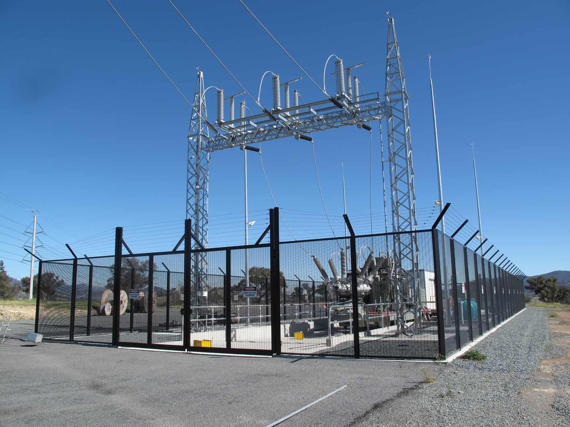 Substation security fencing with anti climb mesh and fence toppings protecting electrical infrastructure